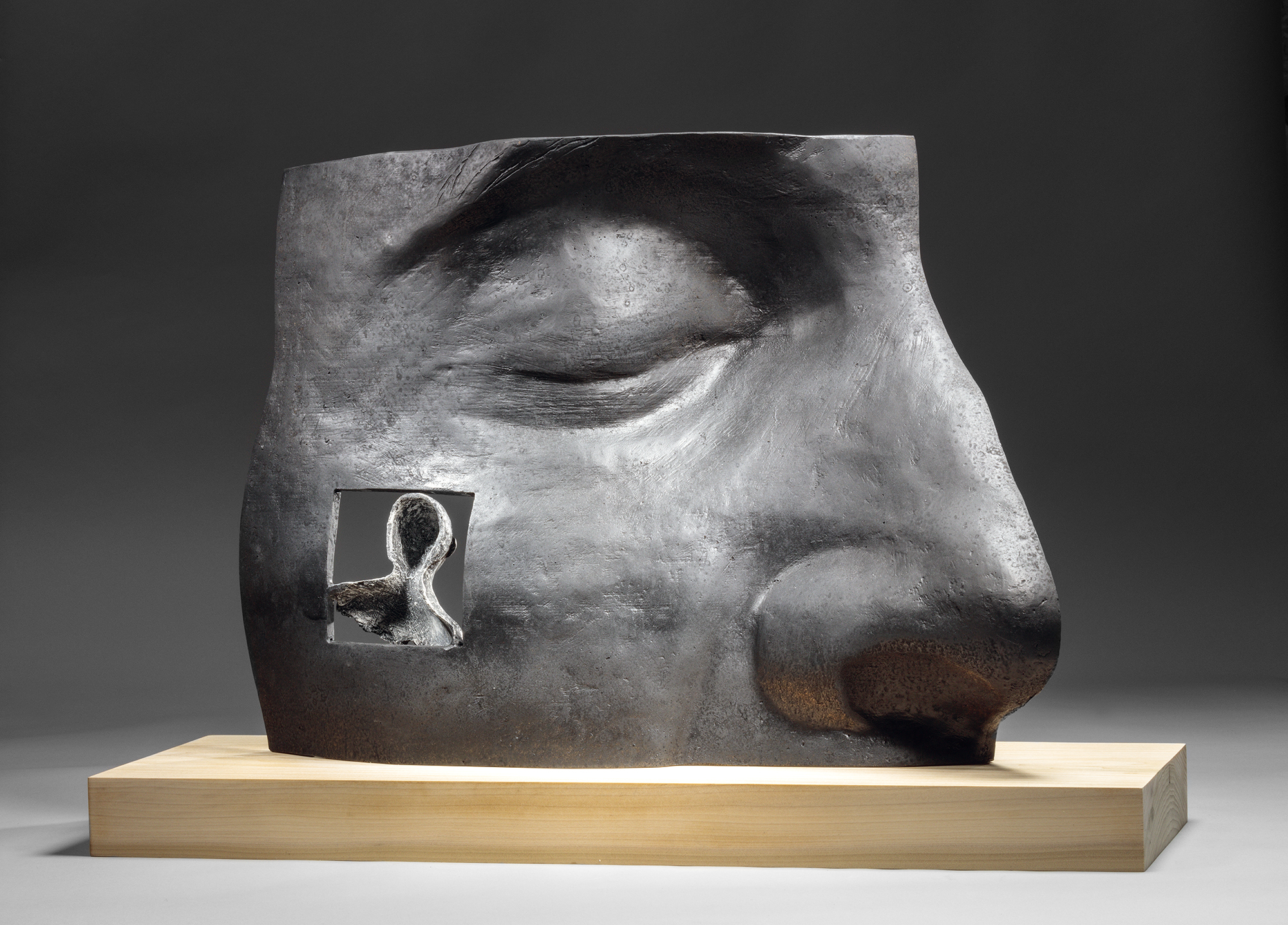 Michael Warrick's 2018 wood and bronze sculpture, “His Memory."