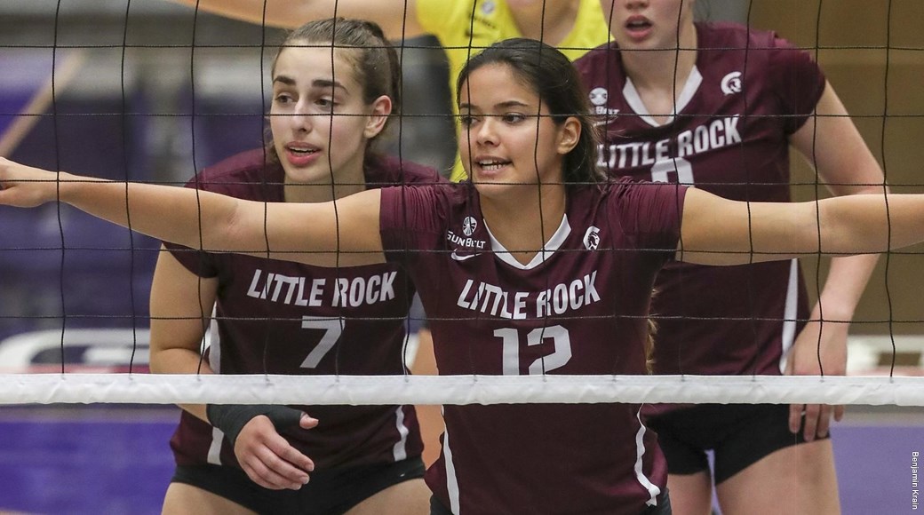 UA Little Rock volleyball players get ready for a block.