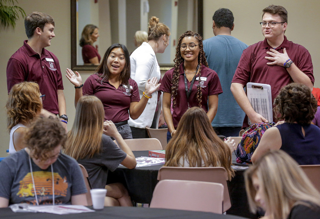 Orientation leaders help incoming students during a freshman orientation session.