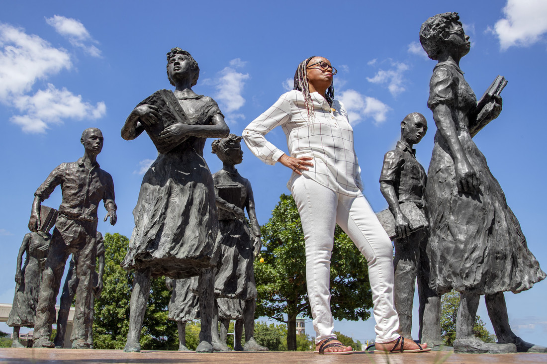 UA Little Rock graduate student Nancy Hall will stands among statue of the Little Rock Nine memorial at the State Capitol. Photo by Ben Krain.