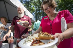 UA Little Rock employees enjoy food from Whole Hog Cafe during BBQ at Bailey. Photo by Ben Krain.