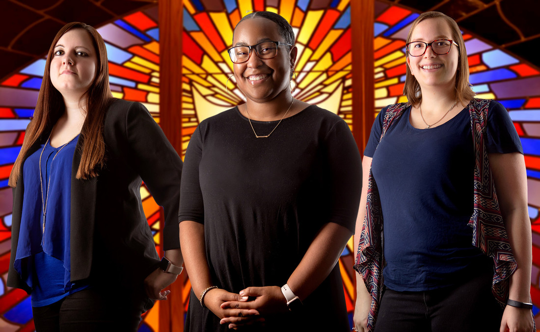 From left, UA Little Rock students Jessica Olson, Jasmine Pugh, and Kaylyn Hager are researching how partnerships between churches and nonprofit organizations can provide services to the community. Photo by Ben Krain.