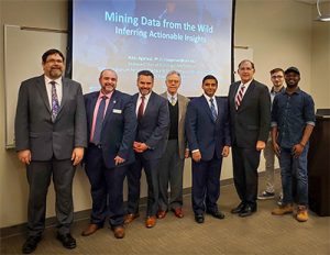 Sen. John Boozman, his staff, and UA Little Rock members hear a research update from Dr. Nitin Agarwal. 