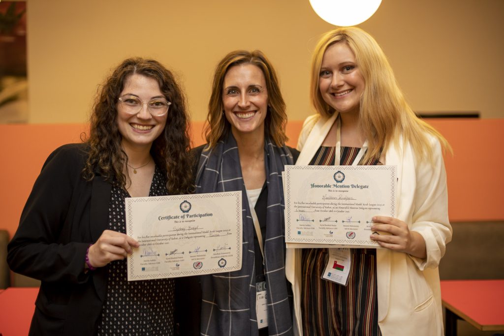 Model Arab League Advisor Rebecca Glazier (middle) poses with Sydney Brazil (left) and Madison Rogers (right), who won awards at the International Model Arab League in Morocco.