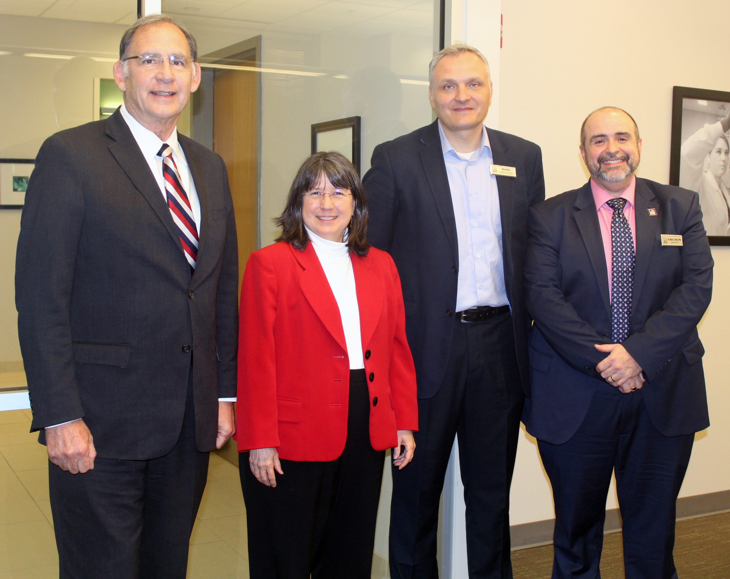 Sen. John Boozman (left) visits with Chancellor Christina Drale, Dr. Alex Biris, and Dr. Brian Berry during a research visit at UA Little Rock.