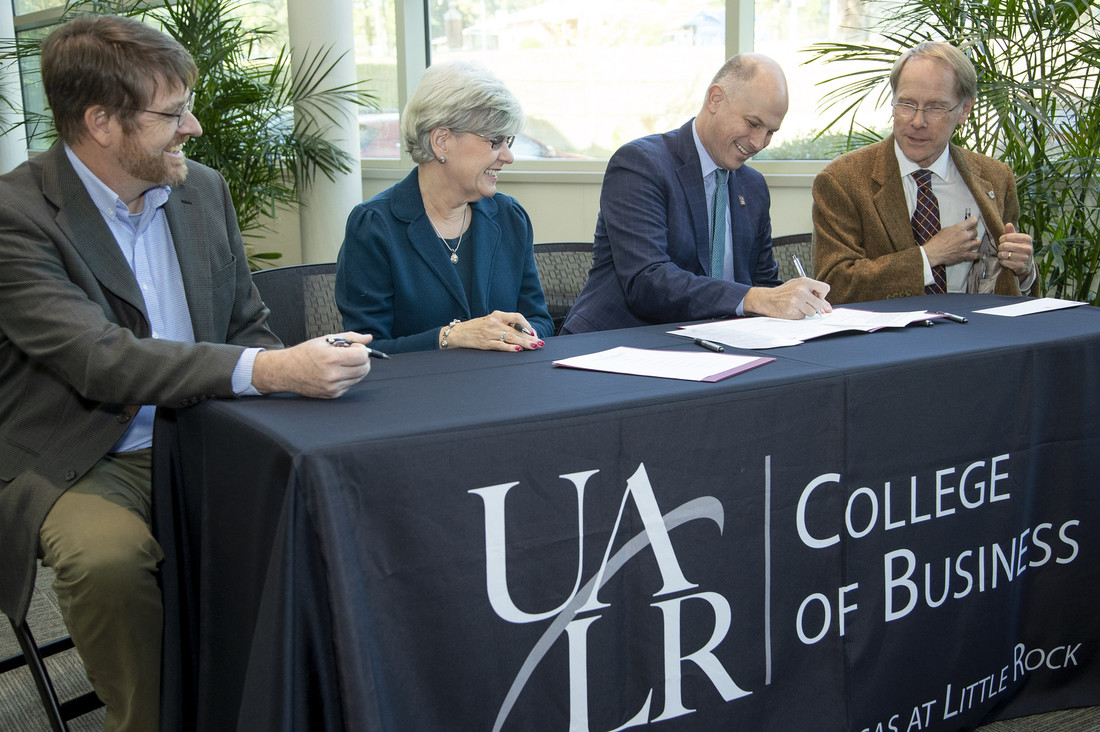 UA Little College of Business students, faculty and staff participate in a Real Estate Scholarship Signing Ceremony with members of the Arkansas Real Estate Foundation Board to establish a scholarship benefiting the Department of Economics and Finance.