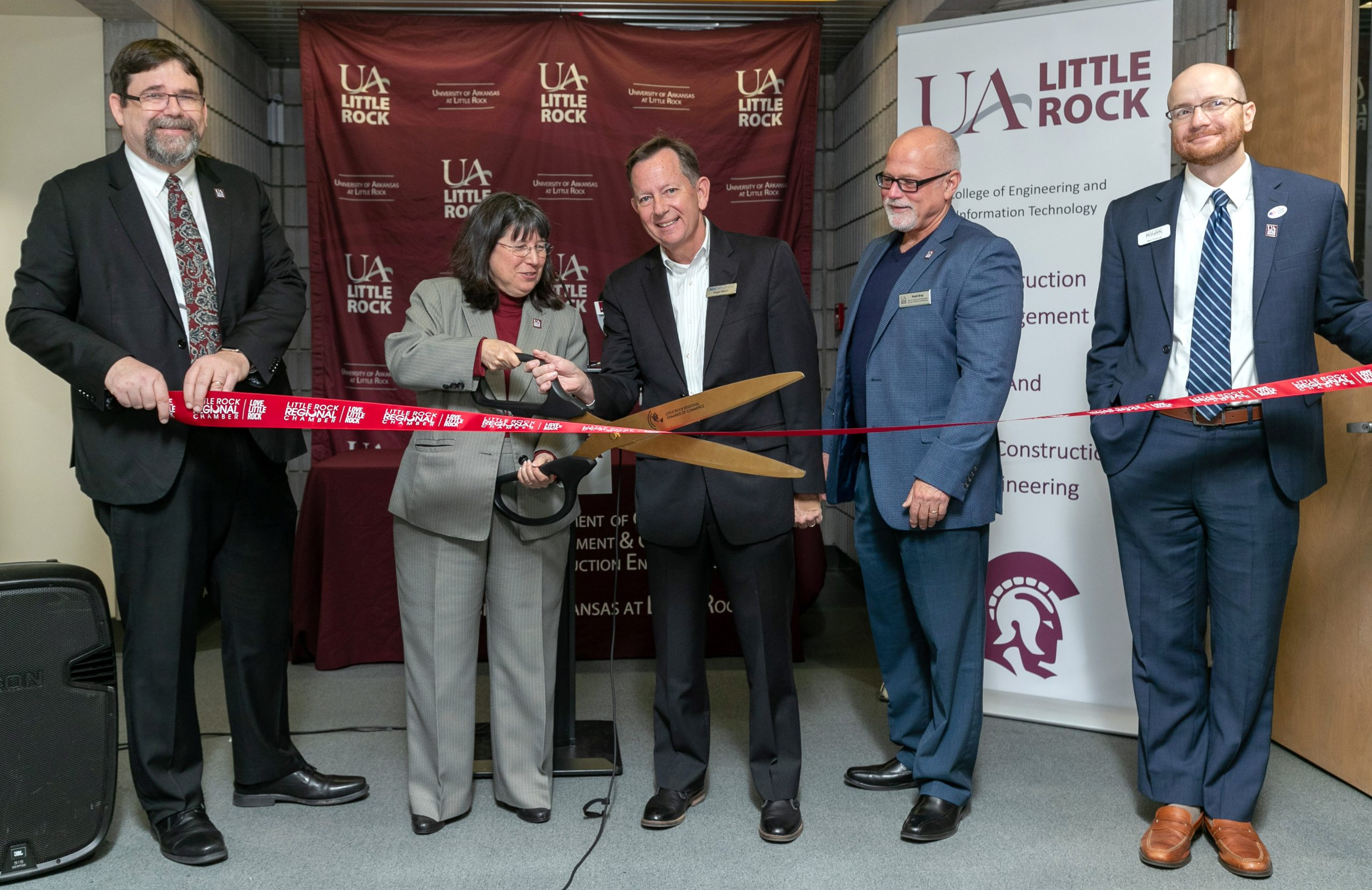 UA Little Rock staff join donors and community leaders in a dedication ceremony for the university’s new AGC of Arkansas Building Information Modeling Lab. Those pictured, L to R, include Dr. Lawrence Whitman, dean of the College of Engineering and Information Technology, Chancellor Christina Drale, Roger Marlin, immediate past president of AGC Arkansas, Dr. Hollis “Hank” Bray, chair of the Department of Construction Management and Civil and Construction Engineering, and Ben France, vice president of economic development at Little Rock Regional Chamber of Commerce. Photo by Ben Krain.