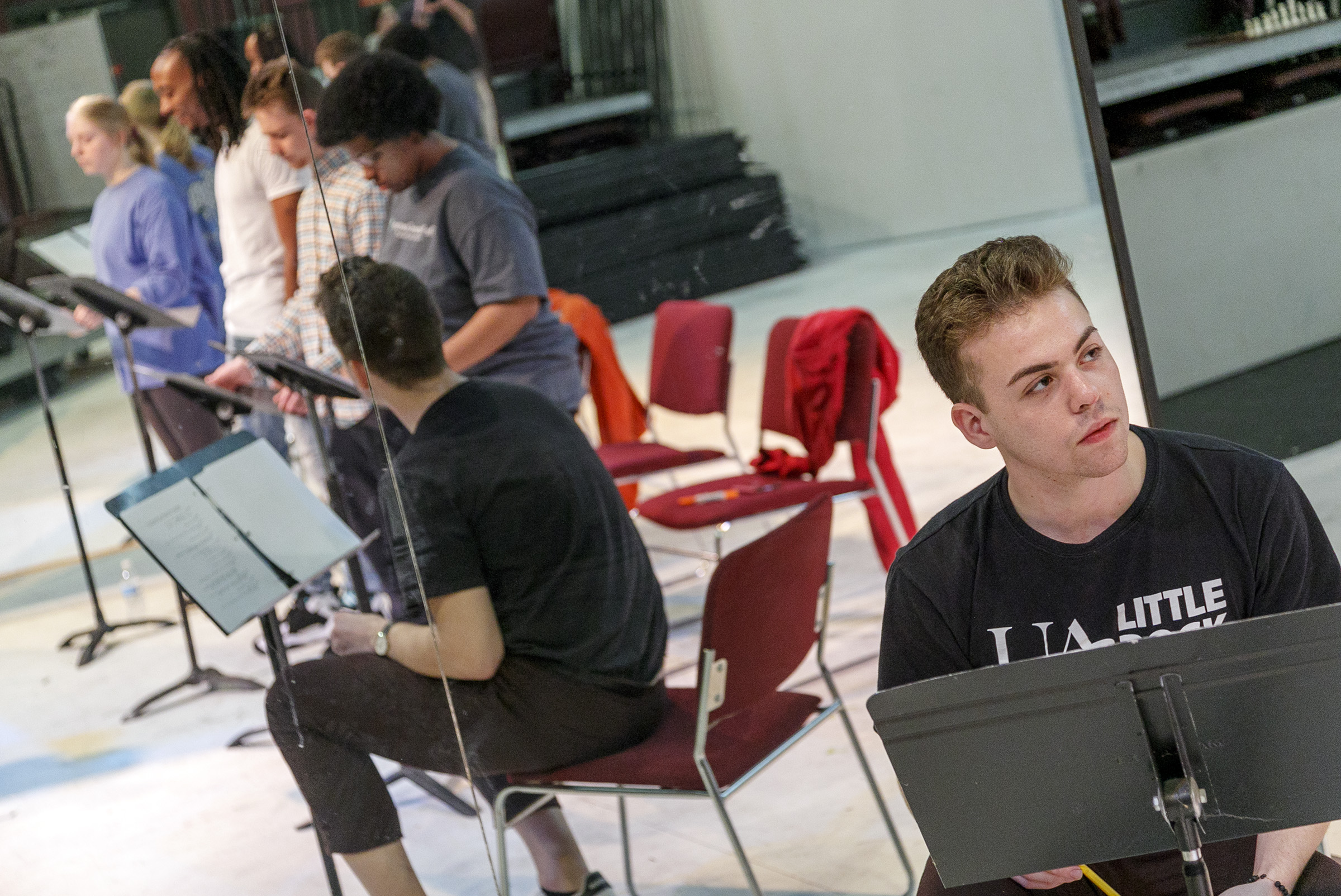 Sophomore theatre major and Donaghey Scholar, Gage Pipkin, rehearses a reading of his play with four student actors. Pipkin's play was selected for the Kennedy Center/American College Theatre Festival (KCACTF) Region 6 John Cauble One Act Play Reading Series. Photo by Ben Krain.