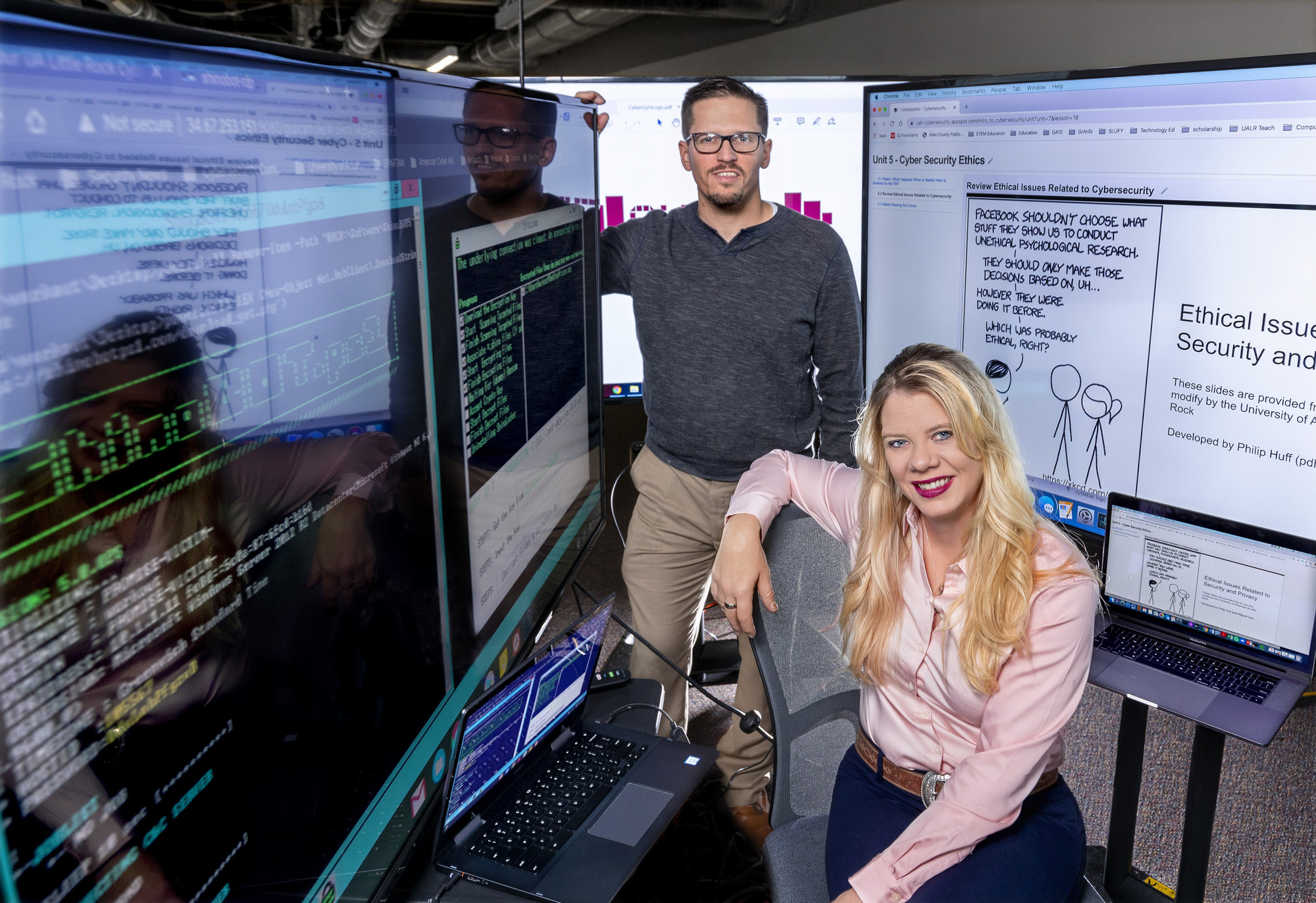 Philip Huff, left, and Sandra Leiterman, right, head the UA Little Rock CyberGym. Photo by Ben Krain.