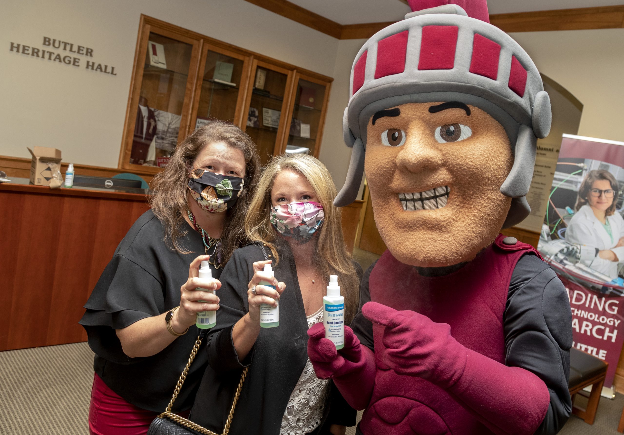 Sisters Becca Bailey, left, who serves as Peach Layne’s director of logistics and operations, and Rachael Oberste, co-founder of Peach Layne, donated nearly 4,000 spray bottles of hand sanitizer to UA Little Rock. Photo by Ben Krain.