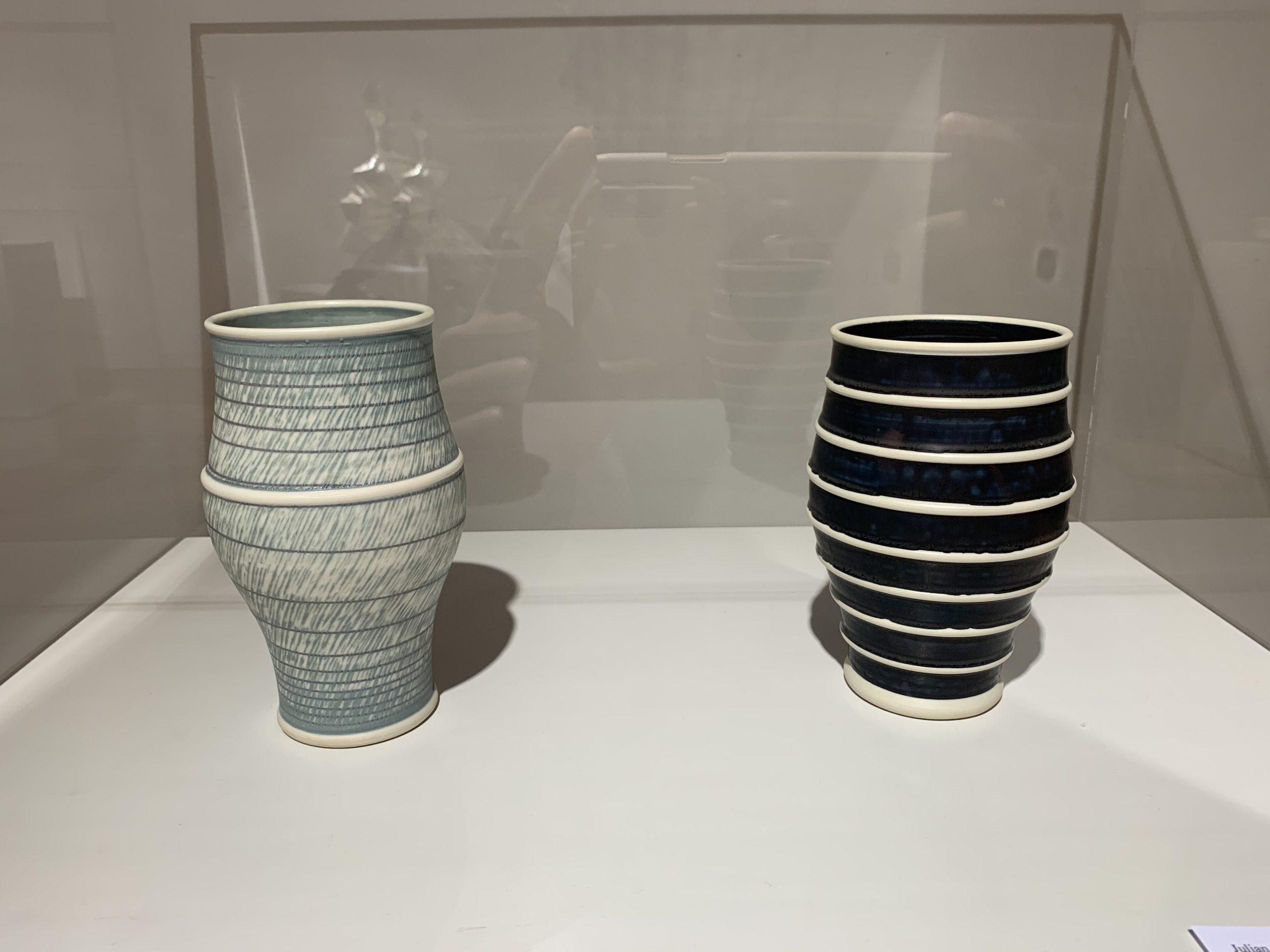 The two porcelain vessels were made by Julian Stair and are gifts of the Diane and Sandy Besser Collection.