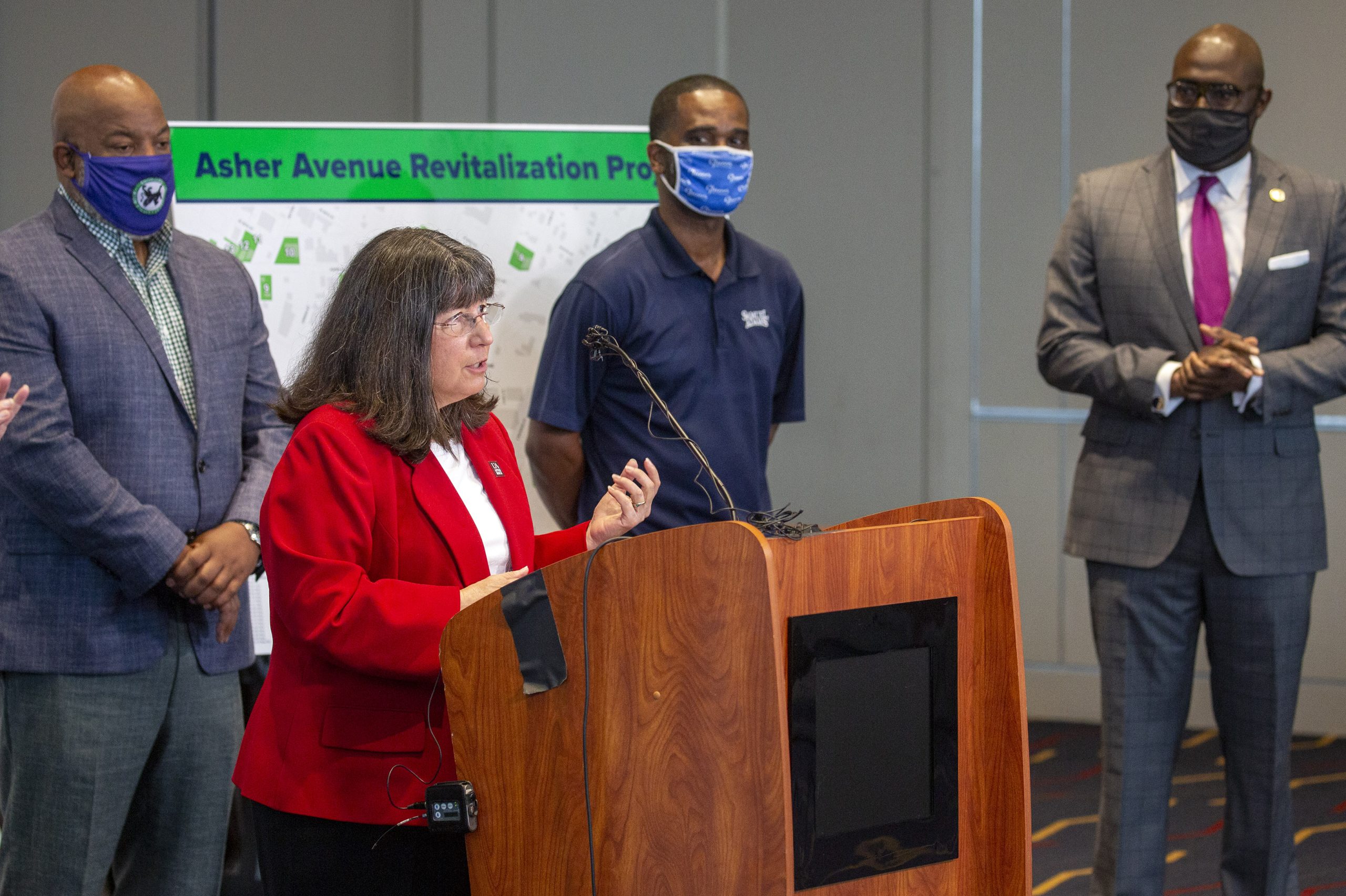 UA Little Rock Chancellor Christy Drale participates in a press conference with Mayor Frank Scott and community developers announcing the city’s plans to revitalize an area of Asher Avenue near the university. Photo by Ben Krain.