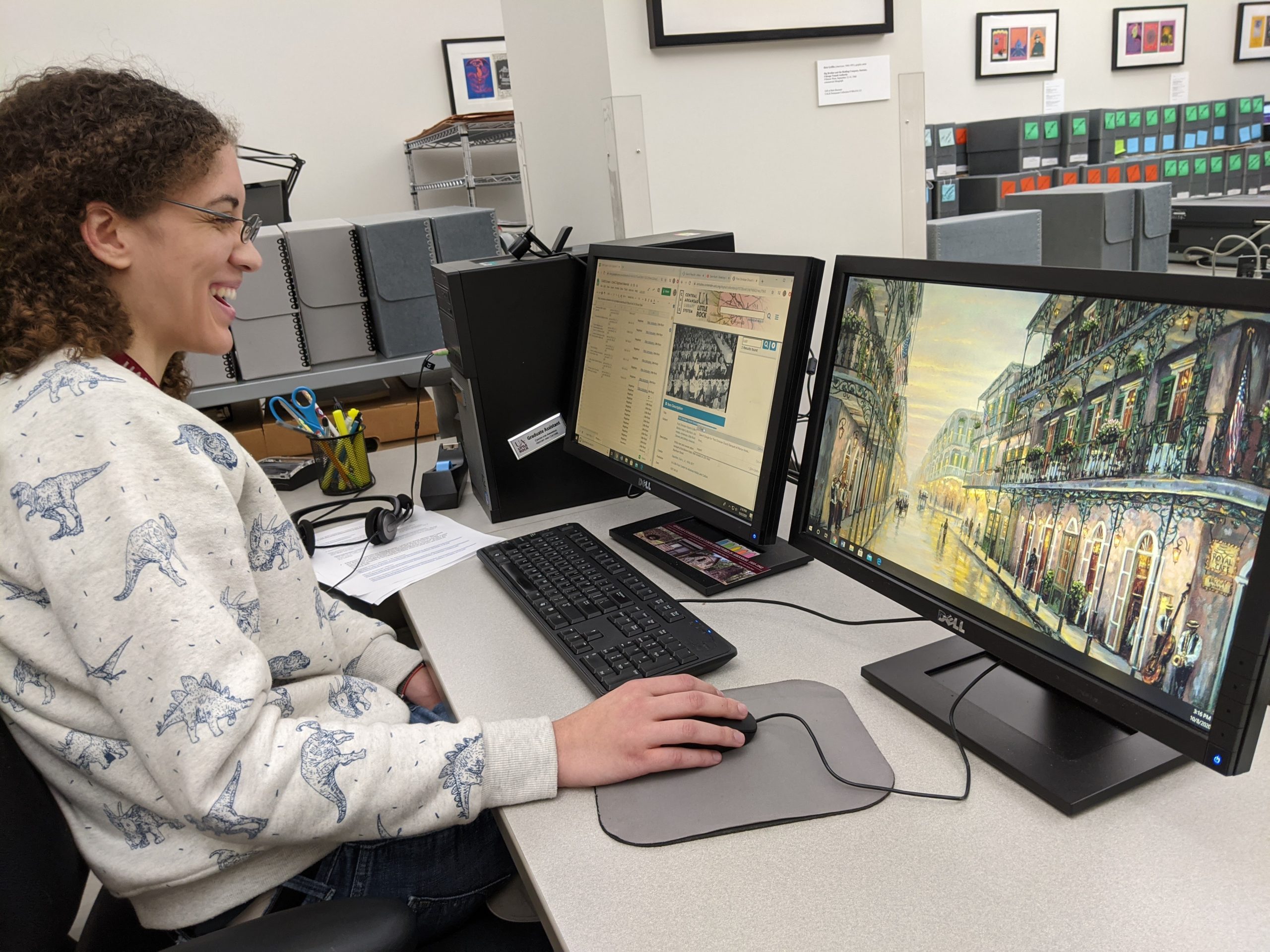 Lauren Fontaine, a graduate assistant with the Center for Arkansas History and Culture, does research at her work station.