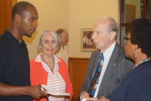 Dr. Allan Ward talks with members of the audience following a discussion of his book.