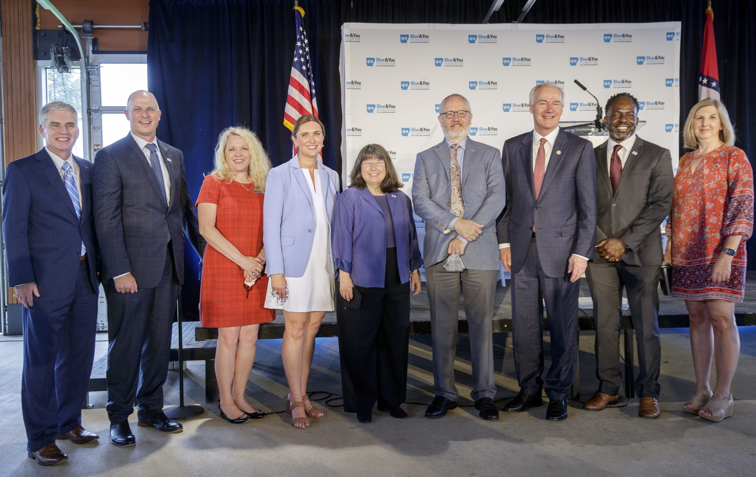 From left, Curtis Barnett, President and CEO of Arkansas Blue Cross and Blue Shield, Christian O'Neal, Vice Chancellor for UA Little Rock University Advancement, Ann Bain, UA Little Rock Executive Vice Chancellor and Provost, Rebecca Pittillo, Executive Director of Blue & You Foundation for a Healthier Arkansas, Dr. Christina Drale, UA Little Rock Chancellor, Stephen Kapp, Director of UA Little Rock School of Social Work, Asa Hutchinson, Governor of Arkansas, Michael Johnson, UA Little Rock Director of Development and External Relations, and Shannon Collier-Tenison, UA Little Rock Interim Dean of the College of Business, Health, and Human Services. Photo by Ben Krain.