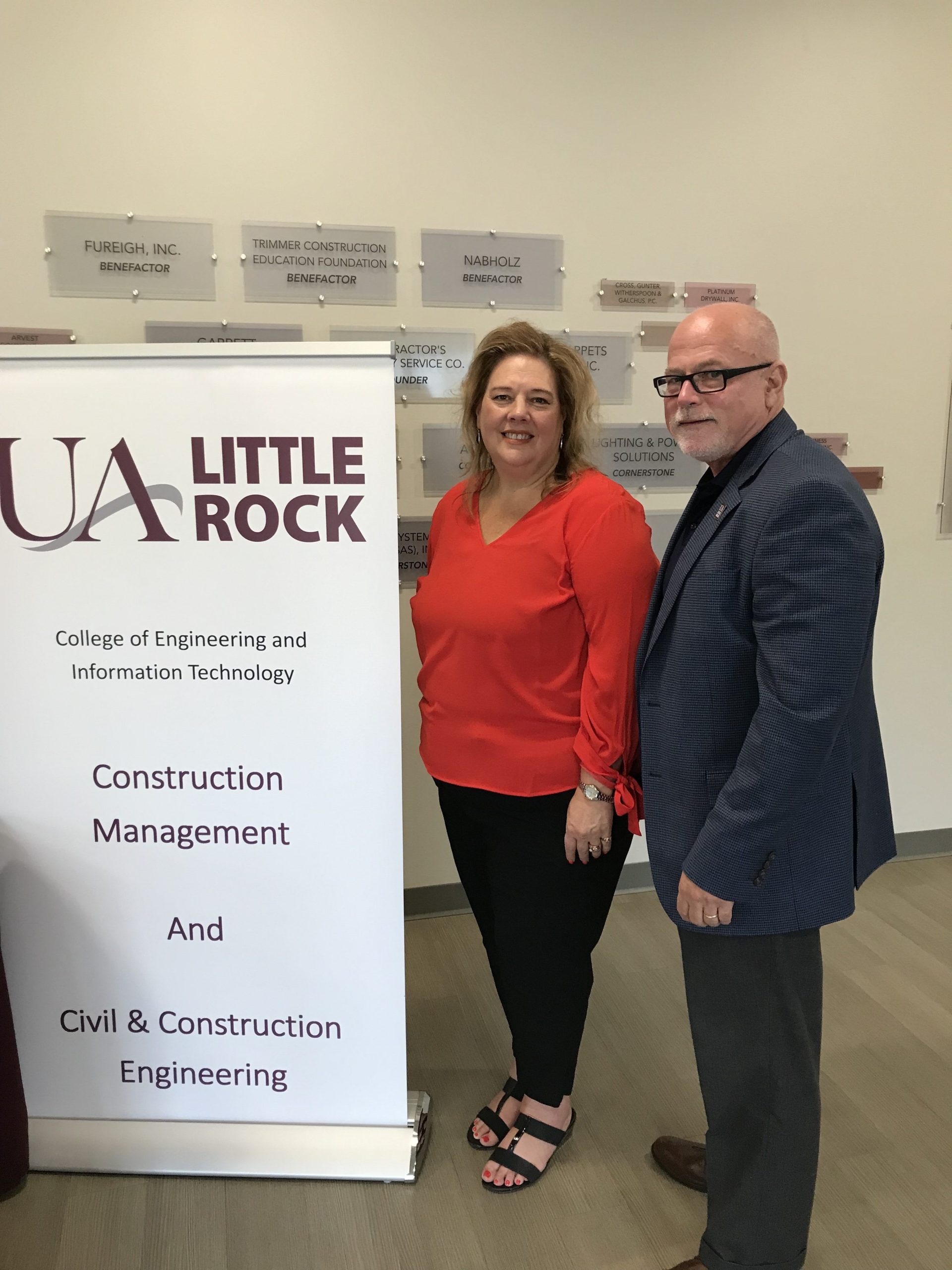 Dr. Cathy Riggins, left, and Dr. Hank Bray, right, discuss a new Associate of Construction Science Degree Partnership between UA Little Rock and Vilonia Pathways Academy Conversion Charter.