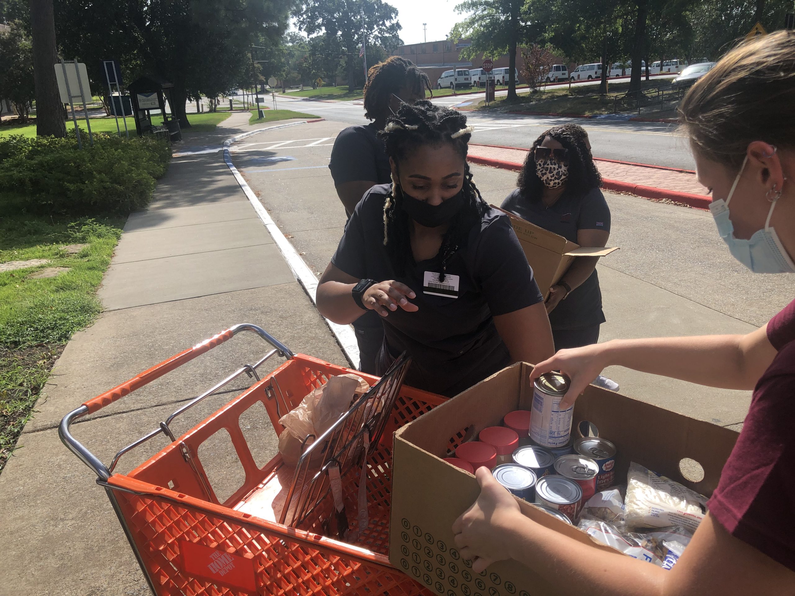 Chancellor's Leadership Corp staff and Nursing students helping with the #Driveup Food Drive on Aug.28. Photo by Corrigan Revels