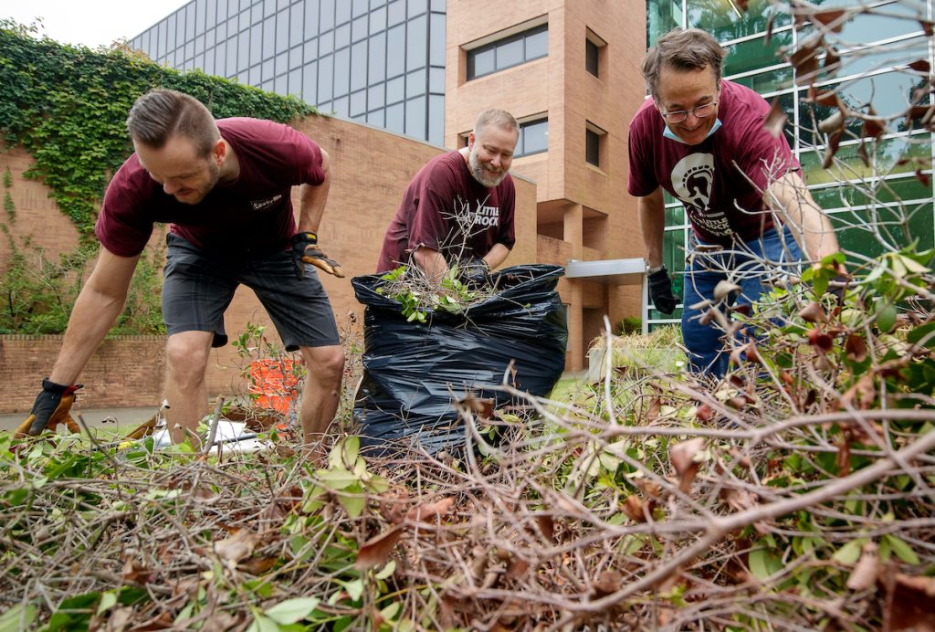 Information Technology Services staff members volunteer their time to help landscape and cleanup parts of campus. Photo by Ben Krain.