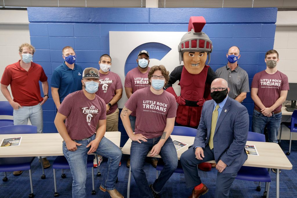 UA Little Rock staff and Construction Management students participate in a grand opening ribbon cutting ceremony dedicating a construction management classroom on campus. Clark Contractors helped pay for renovations to update the classroom. Photo by Ben Krain.