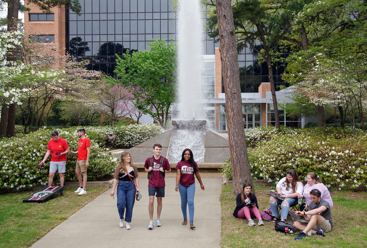 UA Little Rock students hanging out on campus by Cooper Fountain. Photo by Ben Krain.