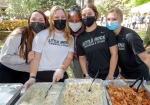 Kristi Smith and student-athlete volunteers for the BBQ at Bailey picnic.