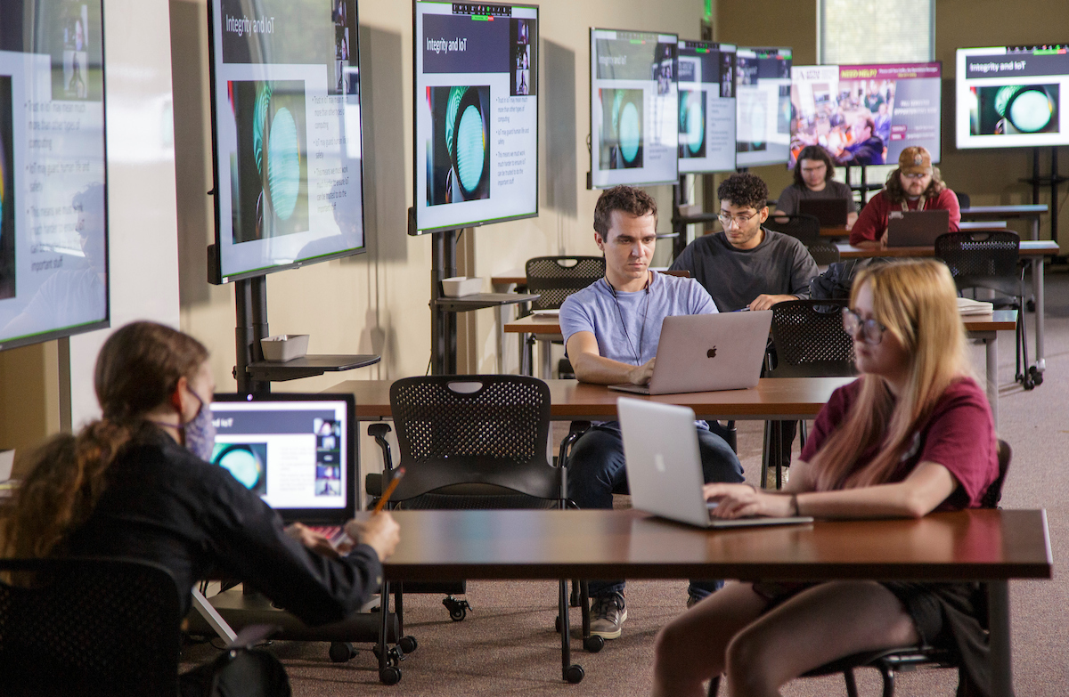 Students in computer lab setups for the Expect More tv commercial featuring STEM and Cyber Gym. Photo by Ben Krain.