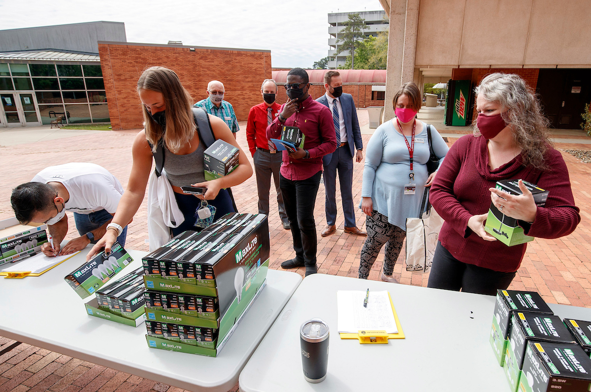 UA Little Rock students and staff take free lamps, power strips and LED light bulbs during an Earth Day event give-away sponsored by the Committee on Sustainability.