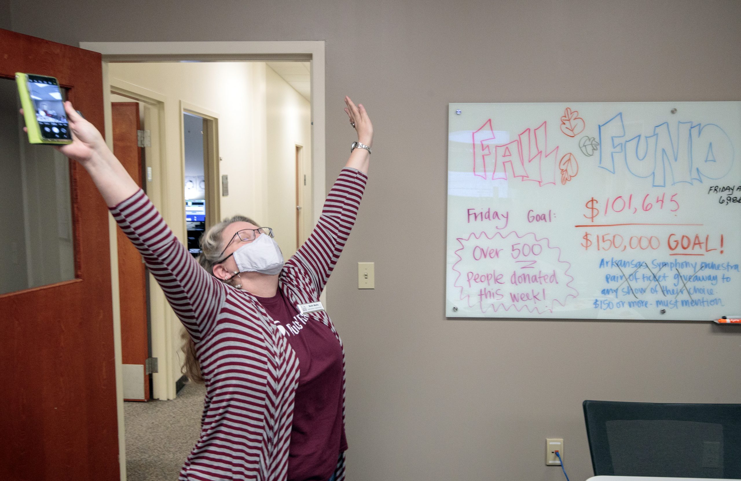 UA Little Rock Public Radio administrator Beth Wells reacts in shock and joy after learning about a $1.5 million gift to the station during its annual fund drive. Photo by Ben Krain.