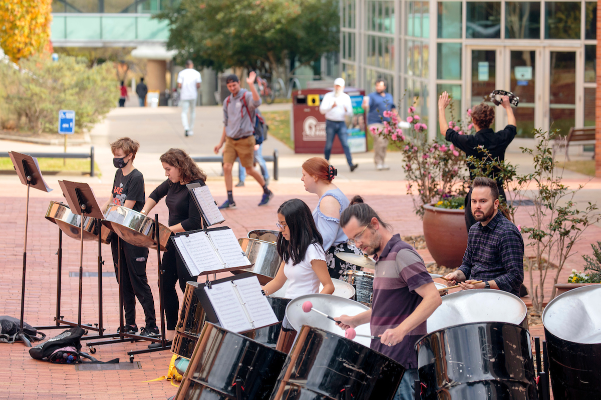 Members of the Trojan Steel Band perform on campus in hopes of collecting donations for the Percussion Club.