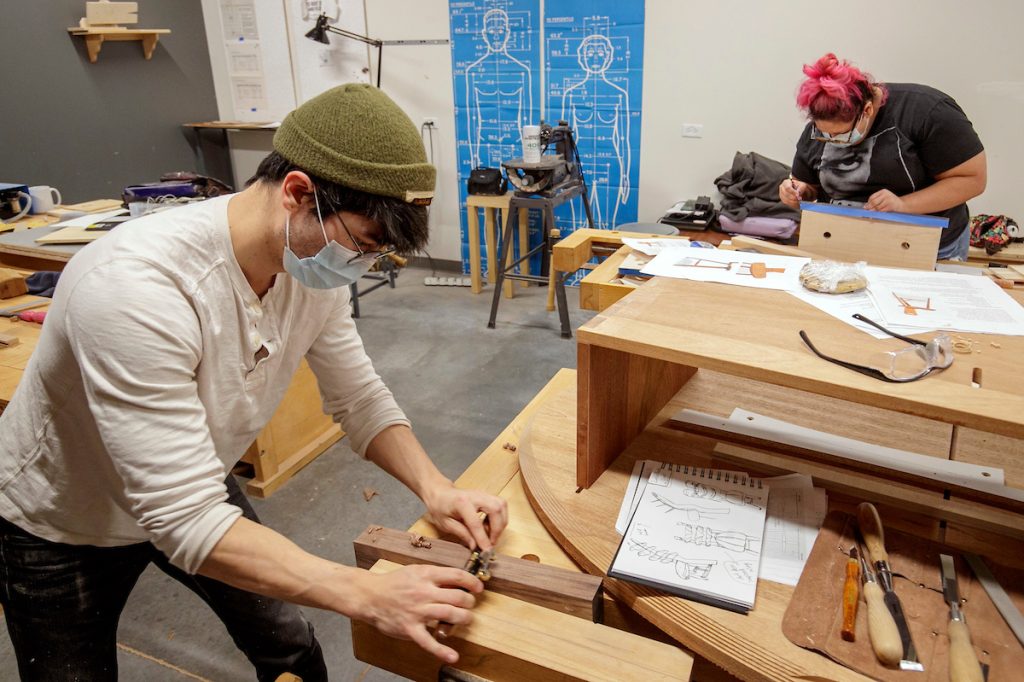 Advanced woodworking students Kim Arcega and Andrew Myers prepare for an upcoming Historic Arkansas Museum exhibit, "Dovetails/We Fit Together." The exhibit is a collaboration between the museum and woodworking students at UA Little Rock. Photos by Ben Krain.