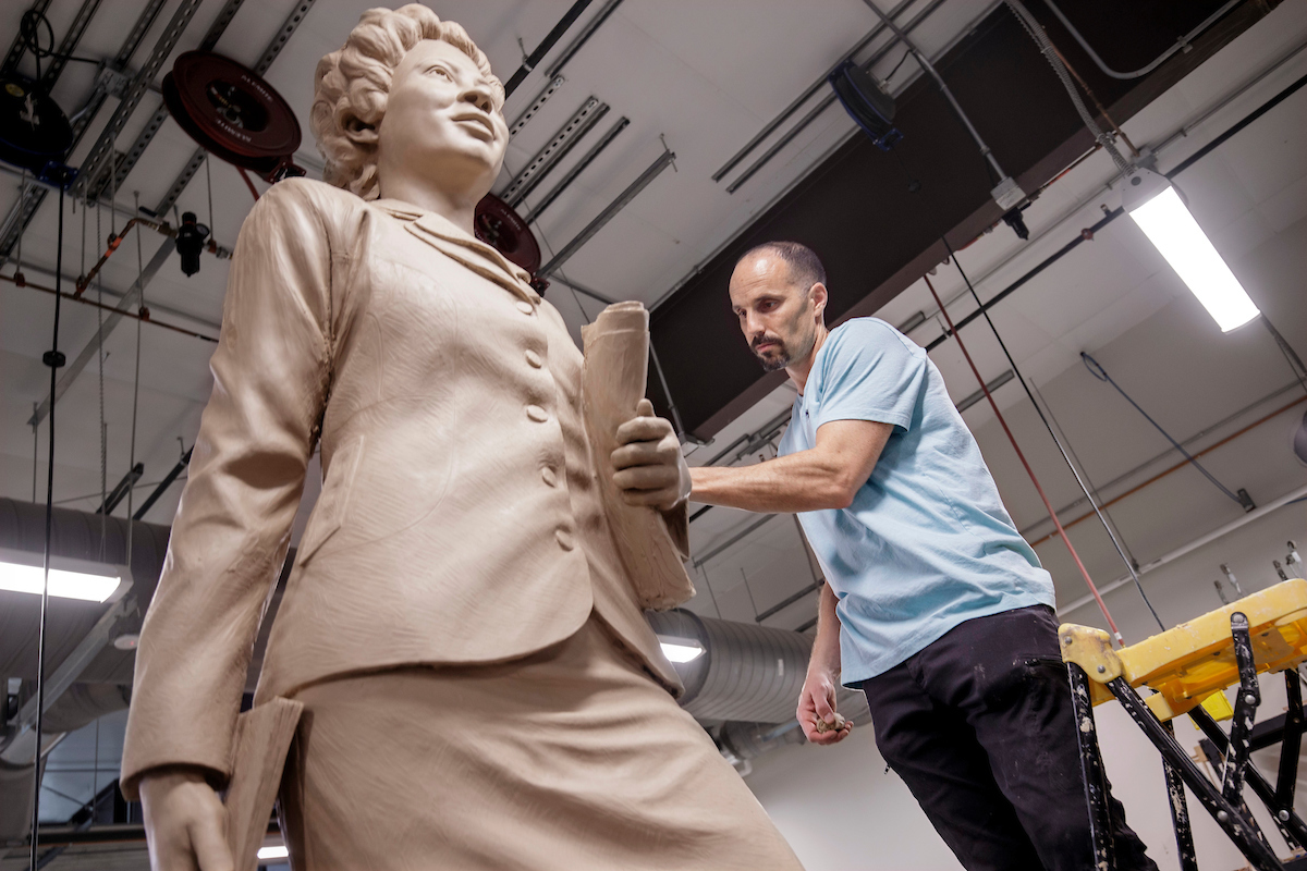 Benjamin Victor works on the sculpture of Daisy Bates in the Windgate Center of Art + Design. Victor has been commissioned by the National Statuary Hall Steering Committee and the Arkansas Capitol Arts and Grounds Commission to create a 7-foot-6-inch bronze sculpture of Daisy Gatson Bates, a renowned civil rights activist. Victor is working on the clay model from which the bronze statue will be cast. He brought the model from his home and studio in Boise, Idaho. Photo by Ben Krain.