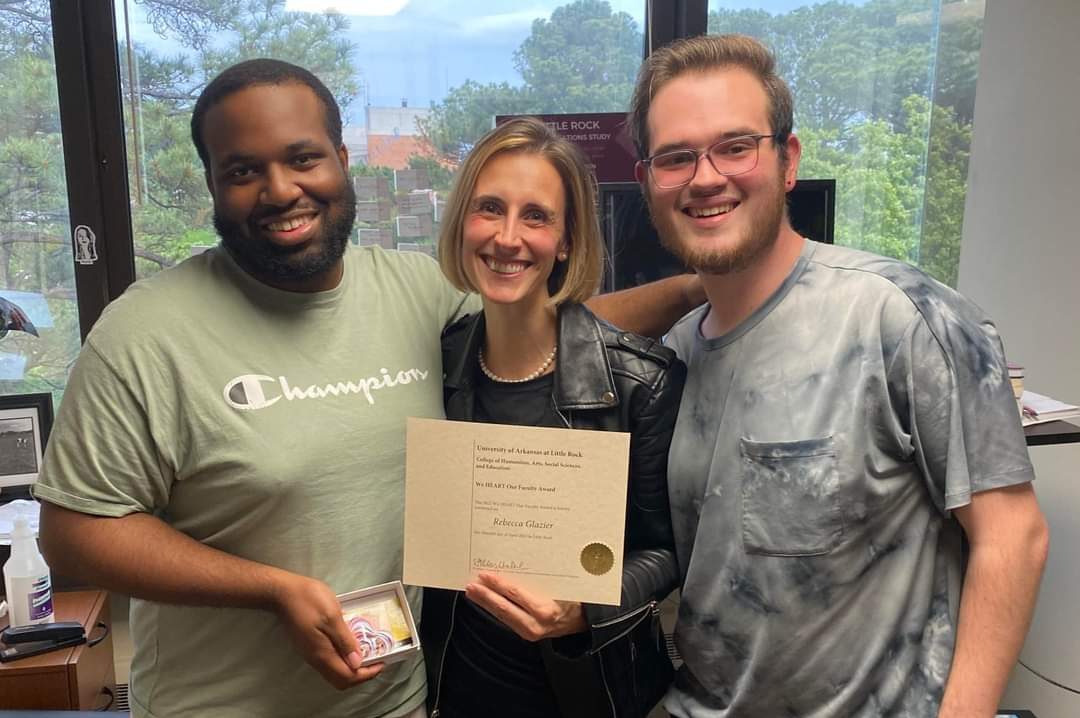 SGA members Lamar Townsend and Caleb Mimms present a Faculty Appreciation Award to Dr. Rebecca Glazier.