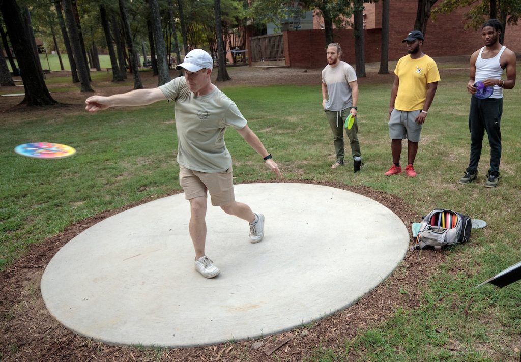 UA Little Rock students enjoy a game of disc golf on the university's new course. Photos by Ben Krain.