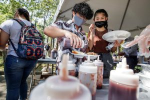 UA Little Rock students and staff participate in the annual BBQ at Bailey's back-to-school picnic.