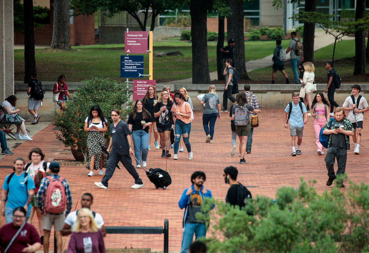 Students walk across campus on their way to class during the first of day the Fall semester.