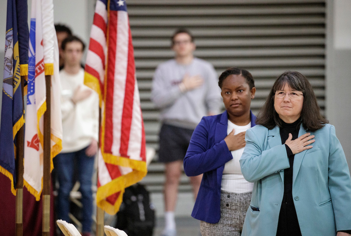 Chancellor Christy Drale, student veteran Jameice Flowers and members of the UA Little Rock Military Student Success Center participate in a Veterans Day ceremony on campus.