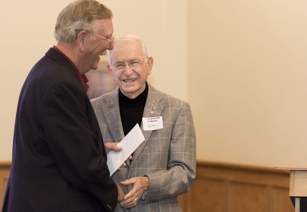 Coach Ballard shares a happy moment with a former basketball player