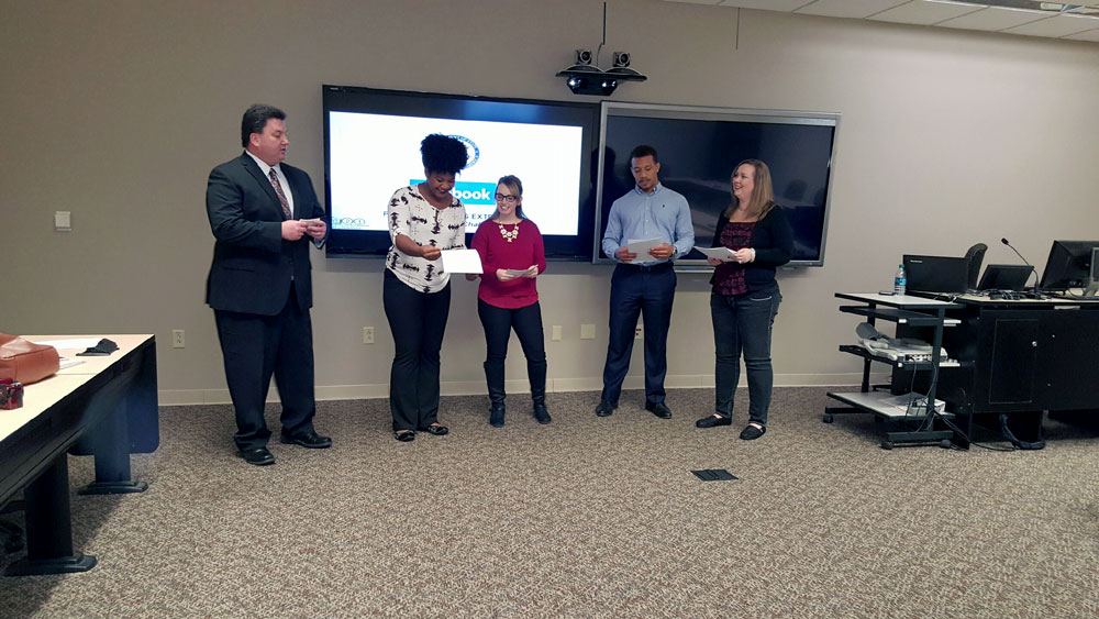 Members of Gary Geissler's advertising development course prepare for a global competition