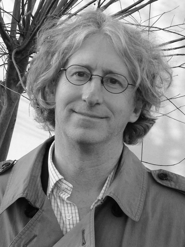 Black and white head shot of Brad Minnick, creator of the KUAR radio show Arts & Letters