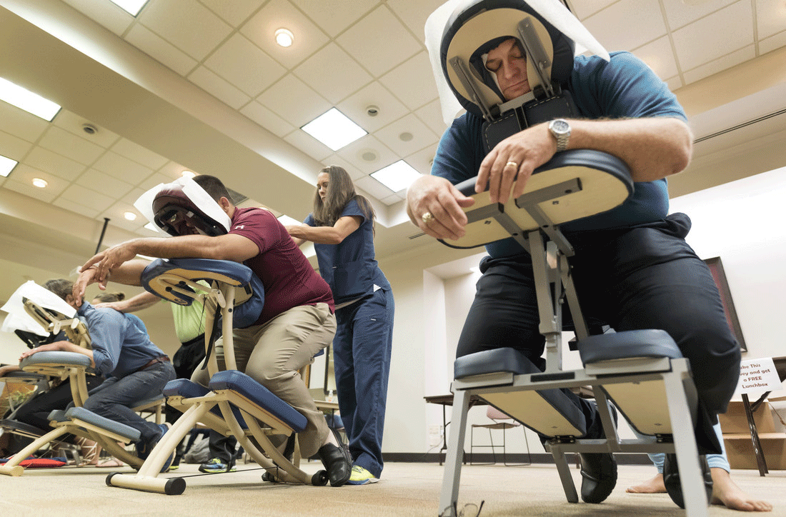 UALR employees receive free massages from the students at Touching America School of Massage in Maumelle during the university's employee wellness fair July 27 in Donaghey Student Center. Photo by Lonnie Timmons III/UALR Communications.