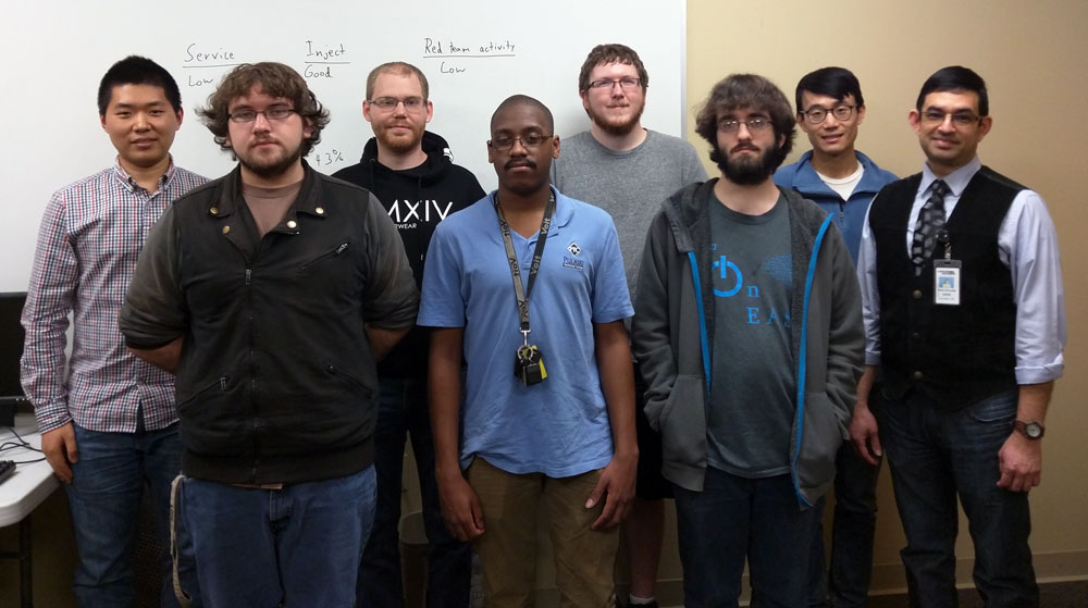The UA Little Rock team advancing to the second round of the Collegiate Cyber Defense Competition include Coach Yanyan Li, Captain Connor Young, Aaron Mays, Hector Fernandez, Jeffrey Wooldridge, Josh Carlat, Malik El-Amin, Shijun Zhong, and Zachary Long.