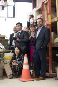 Members of a South Korean Sister Cities delegation watch as Professor Michael Warrick pours bronze for a sculpture that will be given to Hanam City as part of a sculpture exchange between Hanam City and Little Rock. 