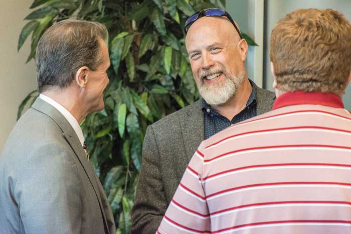 Executive Vice Chancellor for Academic Affairs and Provost Velmer Burton speaks with Tom Clifton, dean of the College of Arts, Letters, and Sciences, during the Sept. 14 “Research in the Rock” reception at the Jack Stephens Center. Photo by Joe Cline Jr./UA Little Rock Communications.