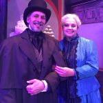 Greg Robinson as Scrooge and Tracy Courage as Belle