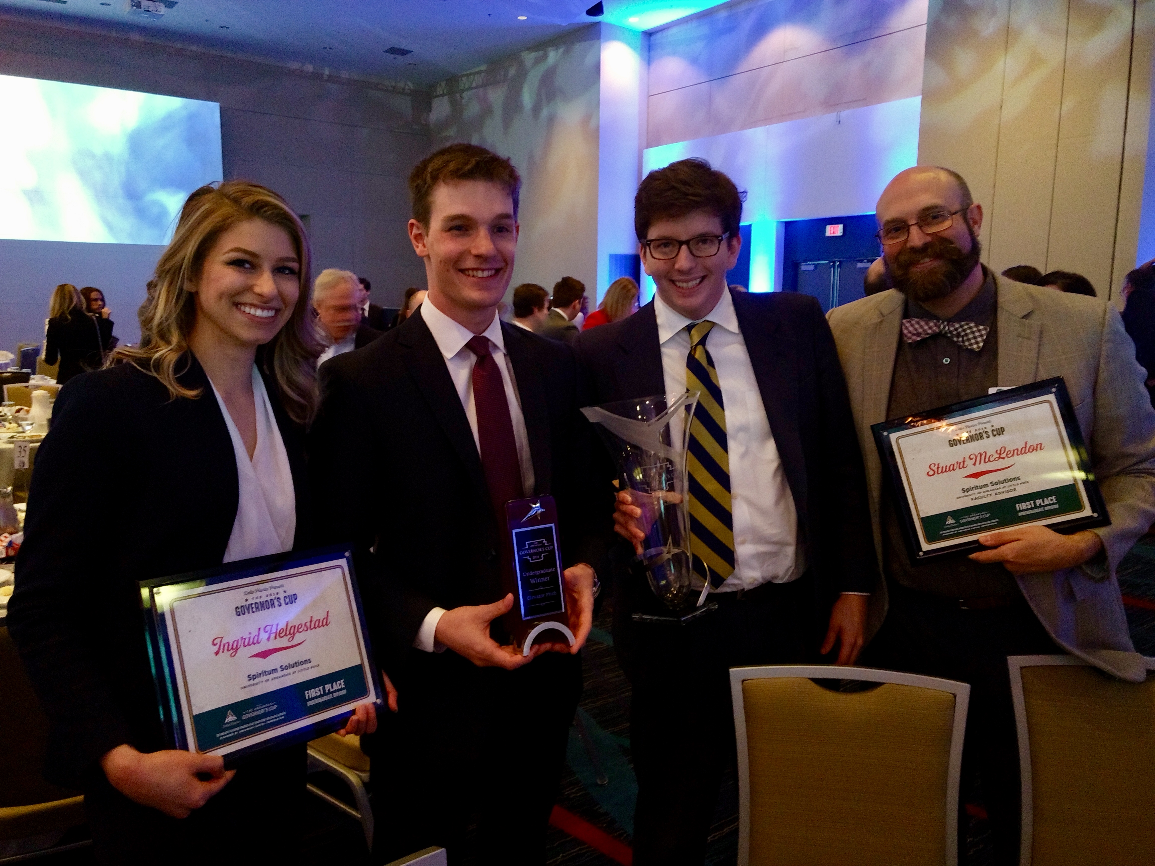 Ingrid Helgested, Noah Asher, Nick Lester, and their faculty advisor Stuart McLendon take first place in the undergraduate division of the Governor's Cup competition.