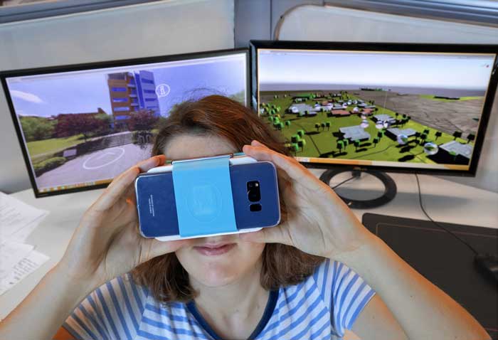 Lea Poignant, one of several students from France interning at the UA Little Rock Emerging Analytics Center during the summer, demonstrates a 360-degree virtual tour of the UA Little Rock campus. Photo by Ben Krain/UA Little Rock Communications.