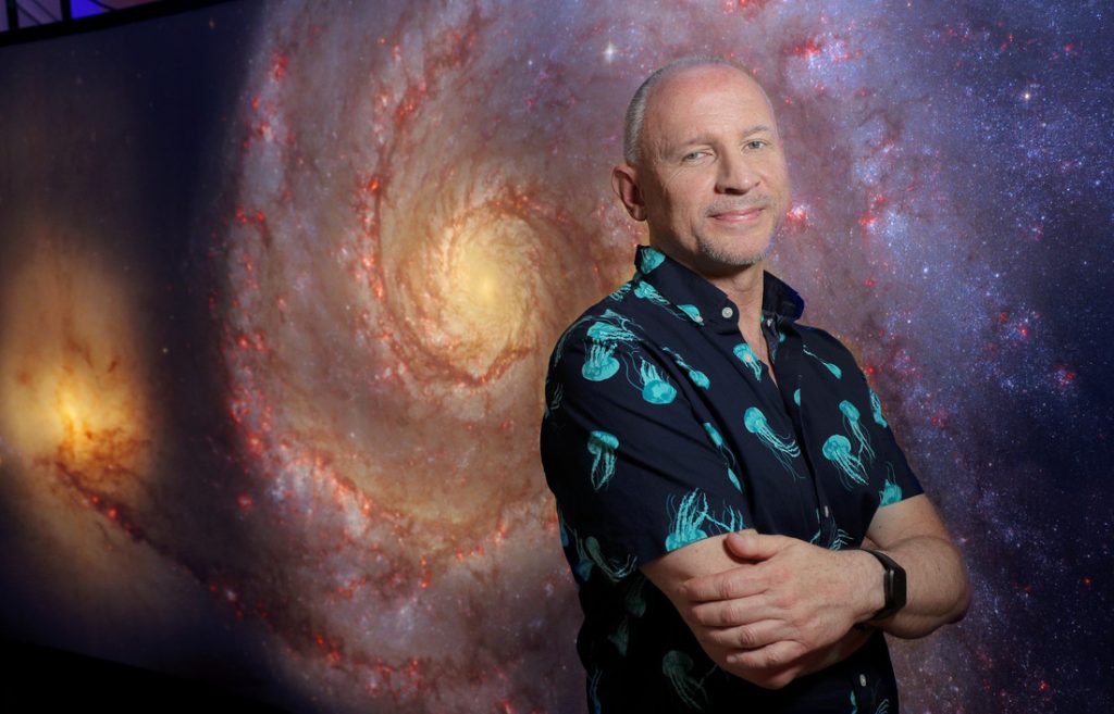 Darrell Heath is a volunteer in the NASA/Jet Propulsion Laboratory's Solar System Ambassador Program, which works to communicate the science and excitement of NASA's space exploration missions and discoveries, some of which can be seen here in the NASA Hubble Space Telescope exhibit at the Laman Public Library in North Little Rock. Photo by Ben Krain.