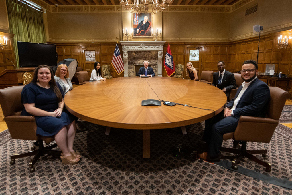 Joshua Johnson, second from right, is shown with Gov. Asa Hutchinson and his fellow summer interns.