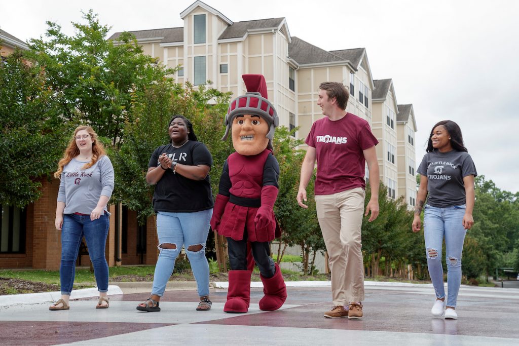 Maximus, the UA Little Rock mascot, is joined by students for marketing setups around campus. Photo by Ben Krain.