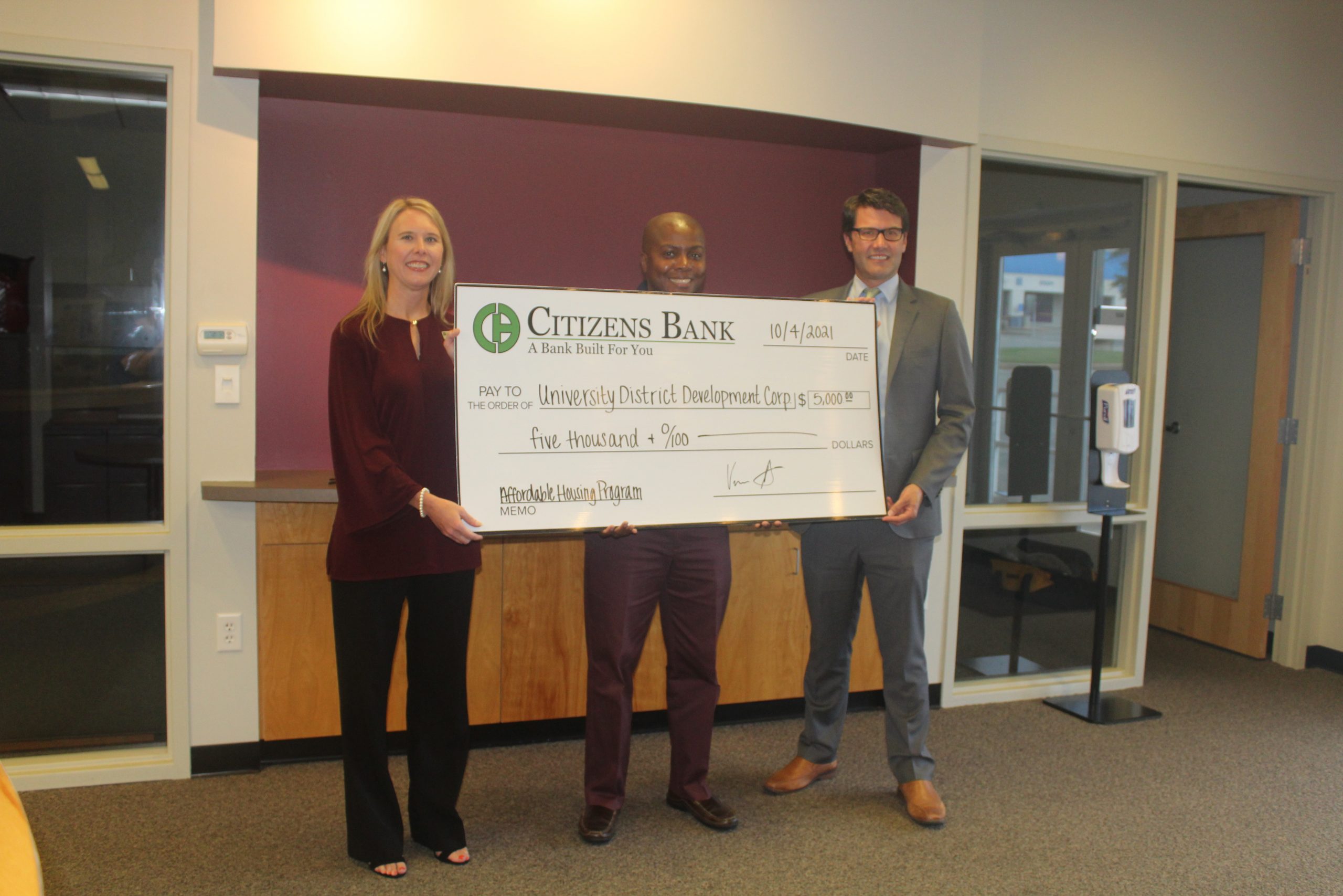 Citizens Bank representatives present a $5,000 donation to the University District Development Corporation to help with affordable housing efforts within University District. Pictured from left to right are Lisa Davis of Batesville, community reinvestment act officer and senior vice president, managing director of enterprise risk management, of Citizens Bank; Barrett Allen of Little Rock, executive director of University District Development Corporation; and Vernon Scott of Little Rock, regional president of Citizens Bank.